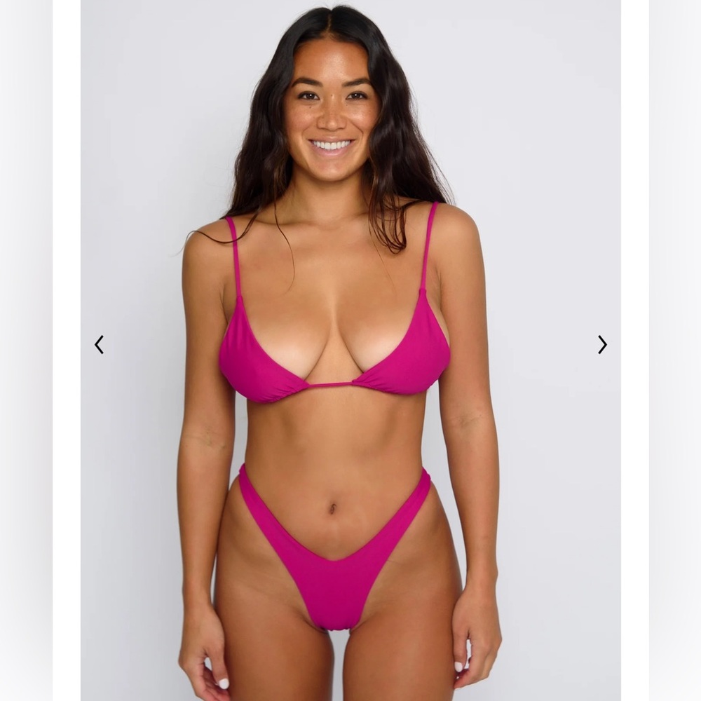 Skatie Bikini Set. “Ella” top and “Melly” bottom in color cosmo. Gently used.